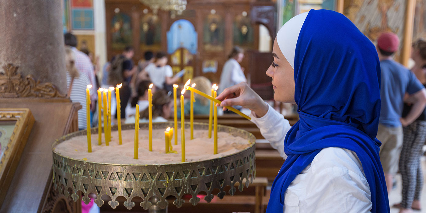 Lighting a Candle in Holy Places at the Holy Land
